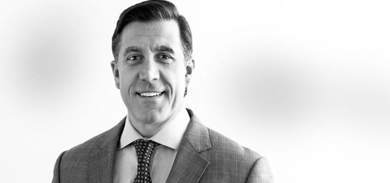 Black and white headshot of Scott Chenevert