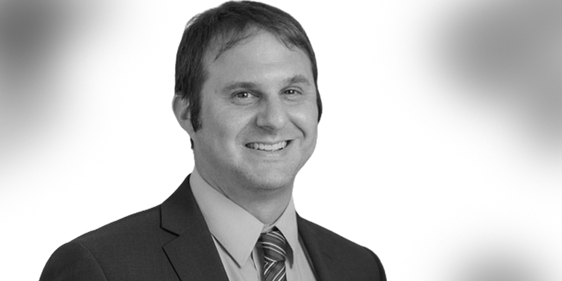 Attorney Justin Swaim black and white headshot