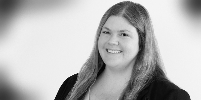 Black and white headshot of Nicolle Lanson