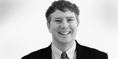 Black and white headshot of Partner Lance McCardle